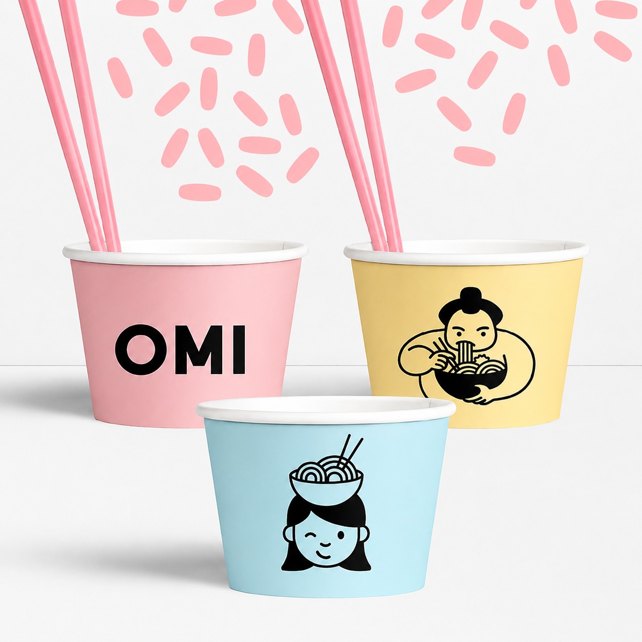 OMI branded paper cups — wordmark and illustration system applied to packaging